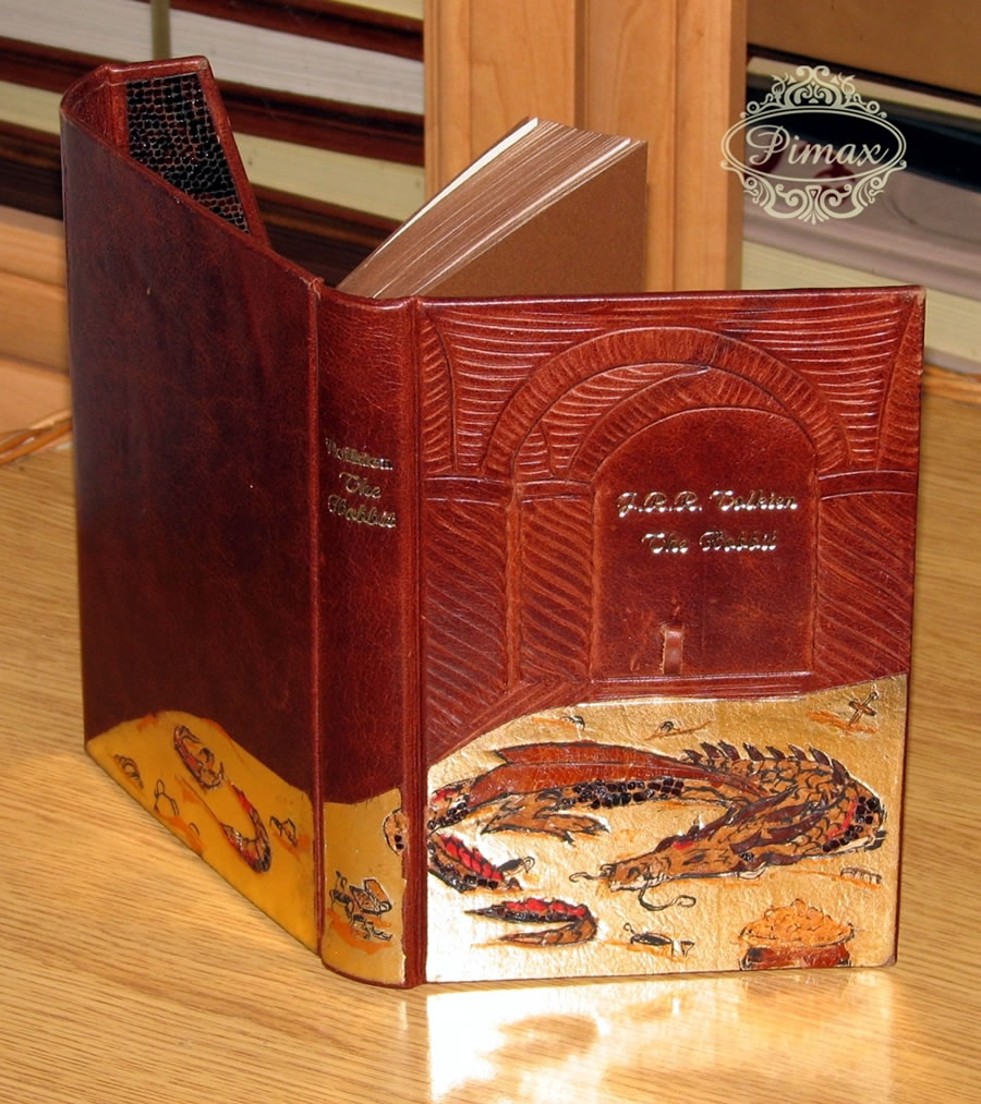 Pimax artistic binding of The Hobbit with a bas-relief onlay and hand-tooled Smaug decoration.